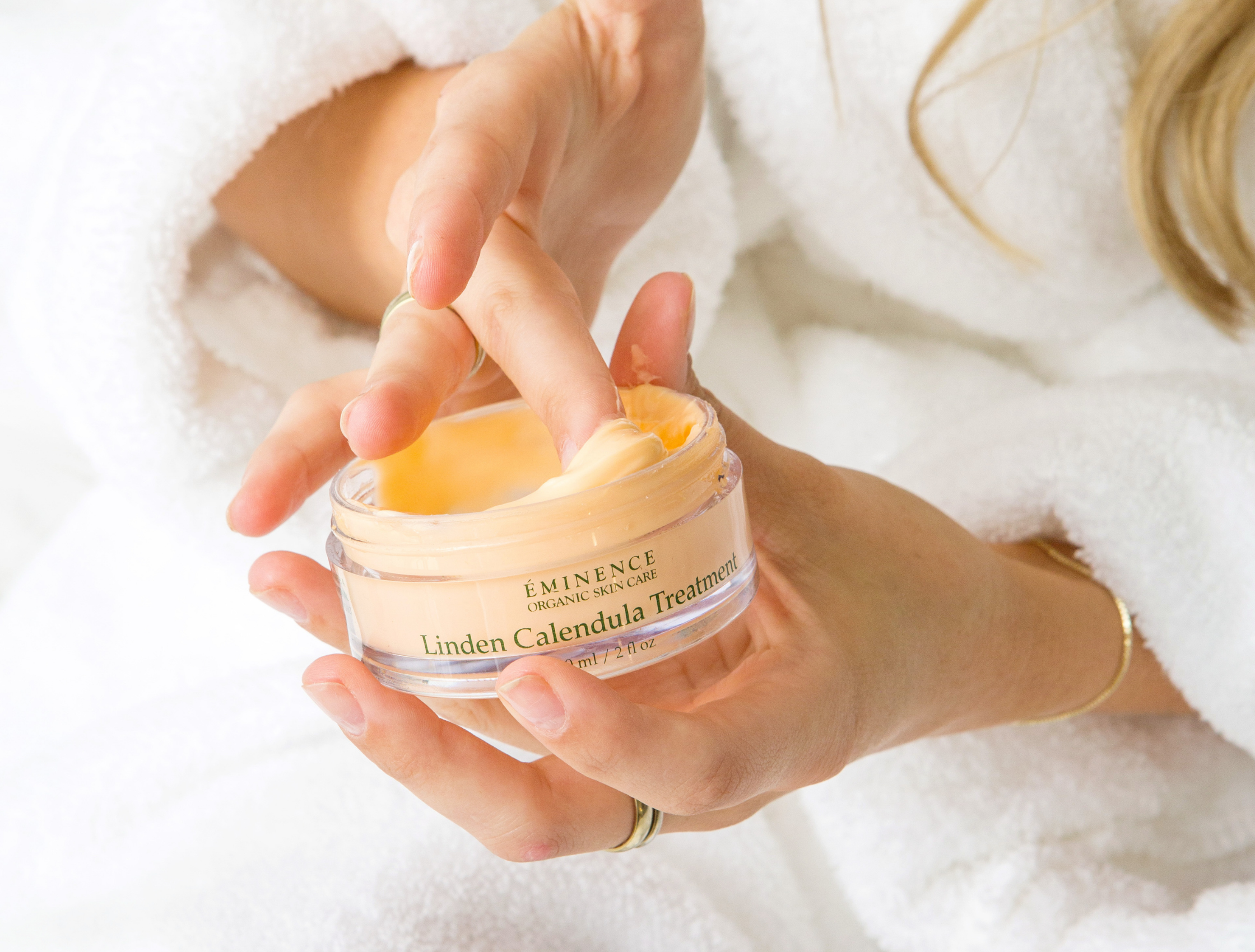 woman washing face over sink organic skincare for dry skin the facial room eminence organics